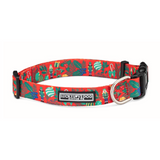 Red adjustable dog collar featuring a Christmas pattern of Nutcrackers, holly, and ornaments.