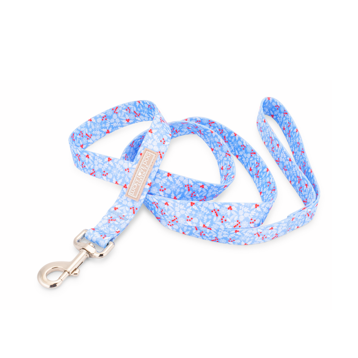 Light blue winter-themed dog leash by Lucky Love Dog Austin with snowflake and berry pattern and a metal clasp.