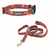 Red Christmas dog collar and matching leash with a Nutcracker, holly, and ornament pattern.