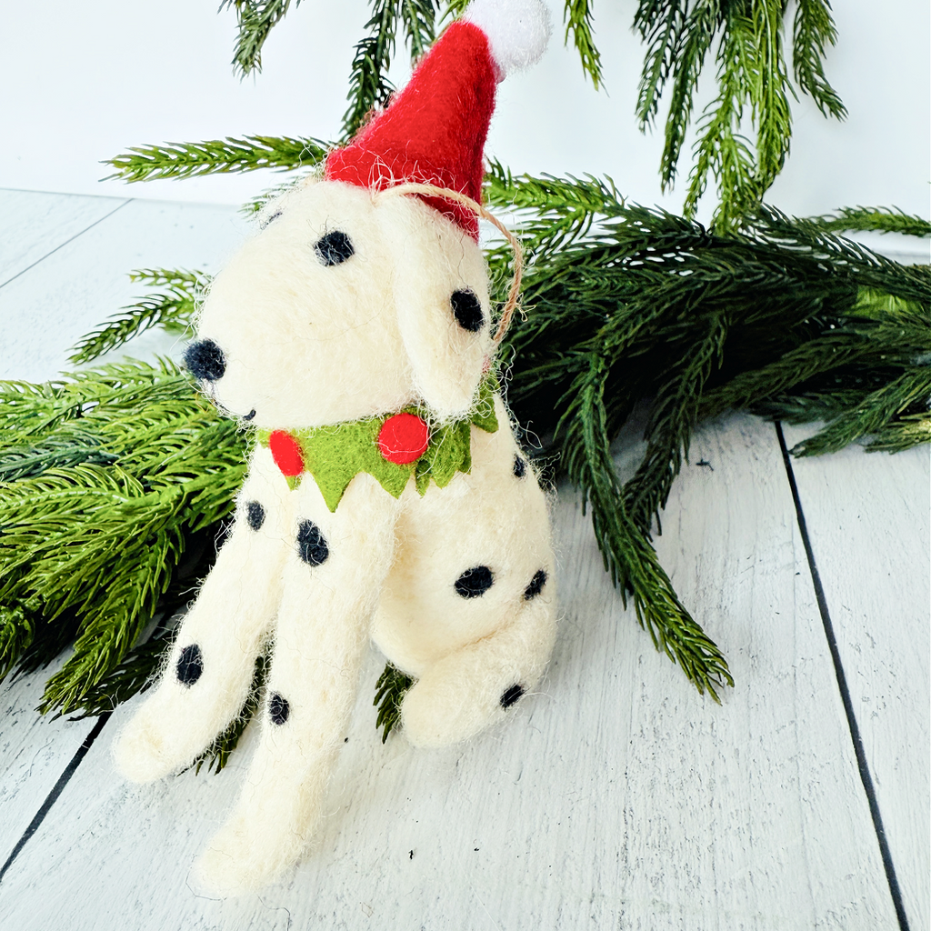 Dalmatian dog Christmas ornament wearing a red Santa hat