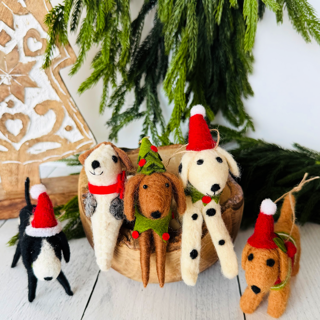 Handmade felt dog Christmas ornament on a tree
