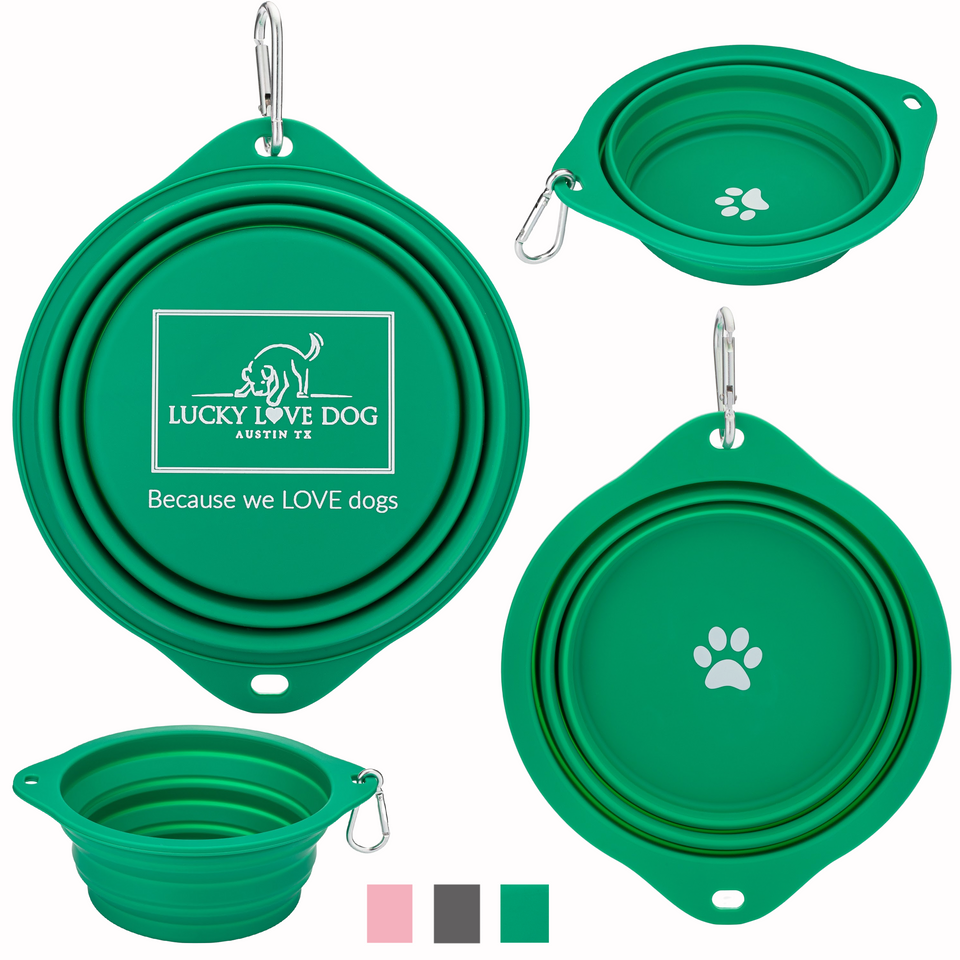 A green, collapsible silicone dog bowl shown from multiple angles, featuring a silver carabiner, a white paw print logo, and the Lucky Love Dog brand name.